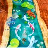 Handcrafted Koi Fish epoxy resin table, meticulously designed with crystal-clear resin, capturing the elegance of Koi fish swimming through flowing water. Combined with premium natural wood, this artistic masterpiece adds a unique touch to any space
