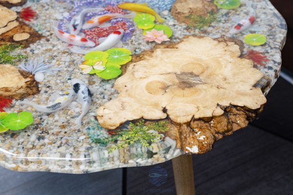 Handcrafted round coffee table for apartments, featuring iconic Koi fish, attractive gravel texture, and clear resin stream effect
