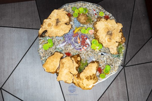 Handcrafted round coffee table for apartments, featuring iconic Koi fish, attractive gravel texture, and clear resin stream effect