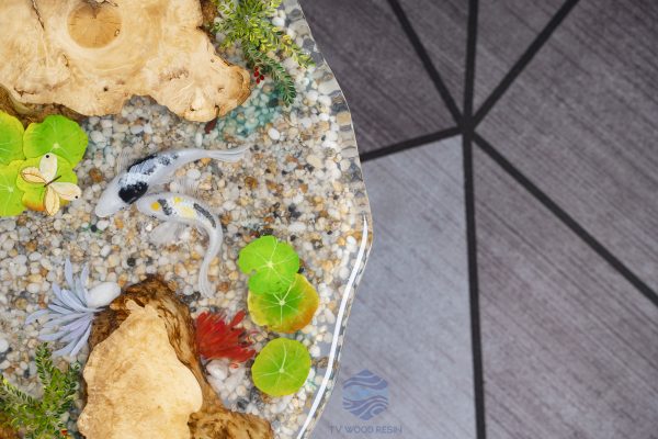 Handcrafted round coffee table for apartments, featuring iconic Koi fish, attractive gravel texture, and clear resin stream effect