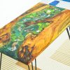 Unique office desk featuring iconic bright yellow Koi fish design and light pine wood