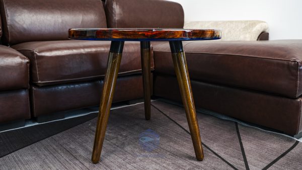 Unique wood and resin round table with captivating Hương wood grain, deep blue mystical water, characteristic Koi, and a special Peach dragon-fish element