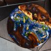 Very special Round Sofa Table with captivating Hương wood, characteristic Koi fish, mysterious deep blue sea resin, and Peach dragon-fish by TV Wood Resin