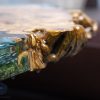 Special Round Sofa Table with characteristic Koi fish, natural burl wood knots, and mysterious moss background by TV Wood Resin