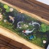 Handcrafted wood and dark epoxy resin meeting table with signature Koi fish art