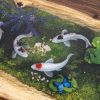 Handcrafted wood and dark epoxy resin meeting table with signature Koi fish art