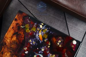 Custom large sofa with intricate Koi fish, golden coin, cherry blossom resin art and precious Sưa wood