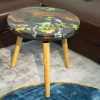 Handcrafted round Koi fish coffee table made from wood and resin with vibrant Koi fish design