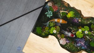 Iconic Handcrafted Wood Resin Coffee Table featuring detailed Koi art and natural burl edge