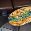Handcrafted wood and resin oval coffee/side table featuring iconic Koi fish and yellow Tamarind wood