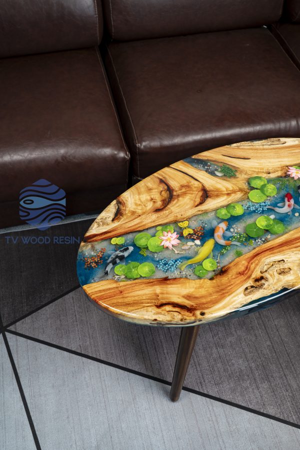 Handcrafted wood and resin oval coffee/side table featuring iconic Koi fish and yellow Tamarind wood