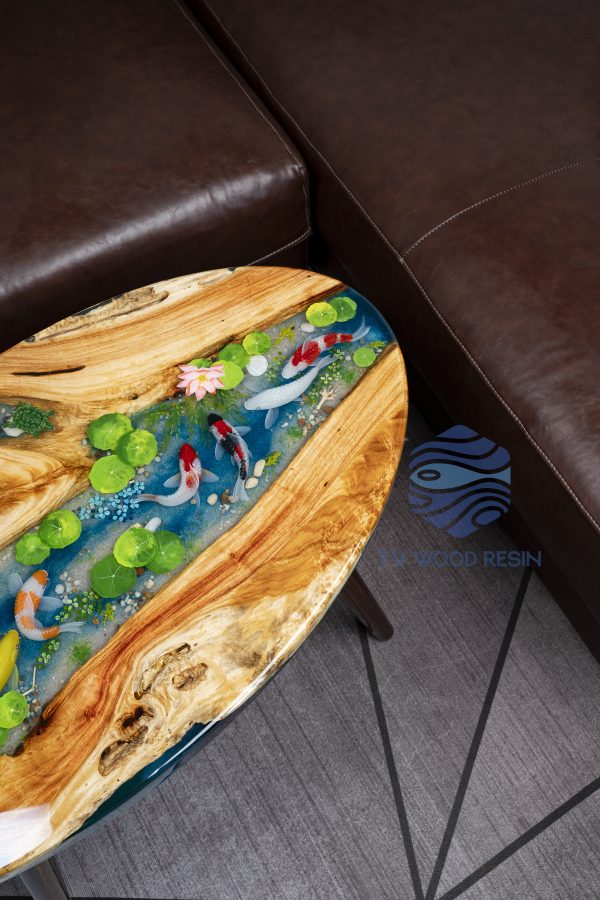 Handcrafted wood and resin oval coffee/side table featuring iconic Koi fish and yellow Tamarind wood