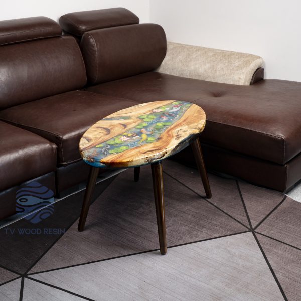 Handcrafted wood and resin oval coffee/side table featuring iconic Koi fish and yellow Tamarind wood
