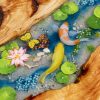 Handcrafted wood and resin oval coffee/side table featuring iconic Koi fish and yellow Tamarind wood