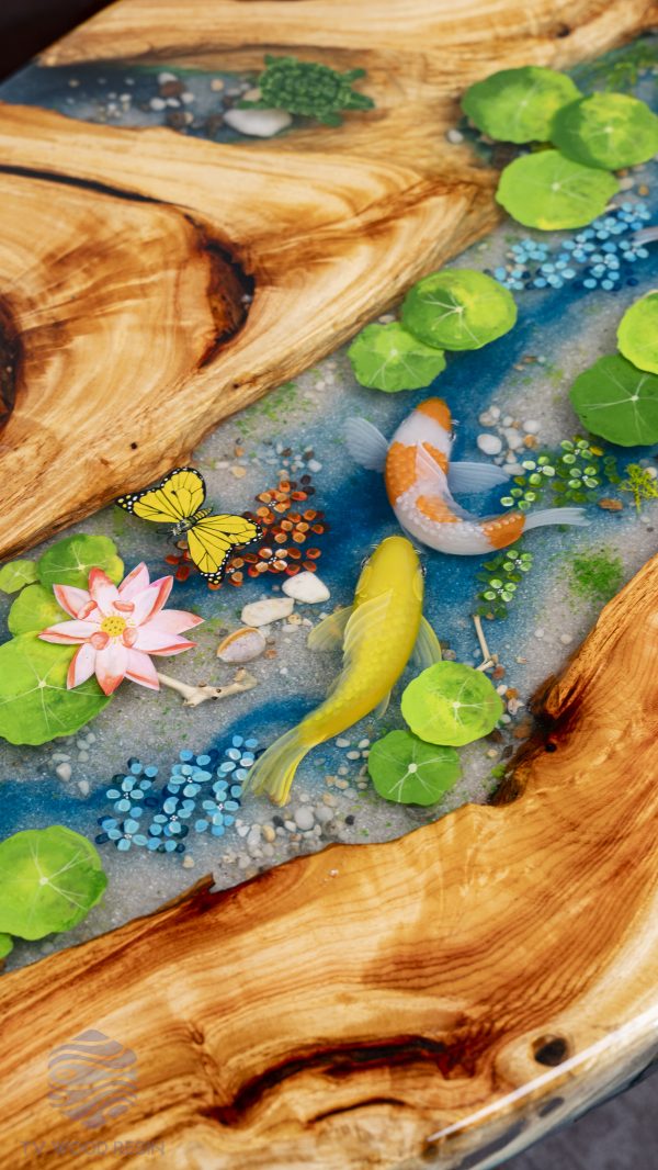 Handcrafted wood and resin oval coffee/side table featuring iconic Koi fish and yellow Tamarind wood