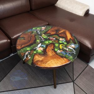 Handcrafted round coffee table for apartments, featuring iconic Koi fish, moss base, and rich red-brown Sưa wood